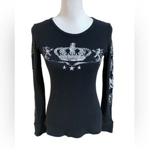 Love Culture women’s long sleeve black ribbed top. Bejeweled queen’s crown.